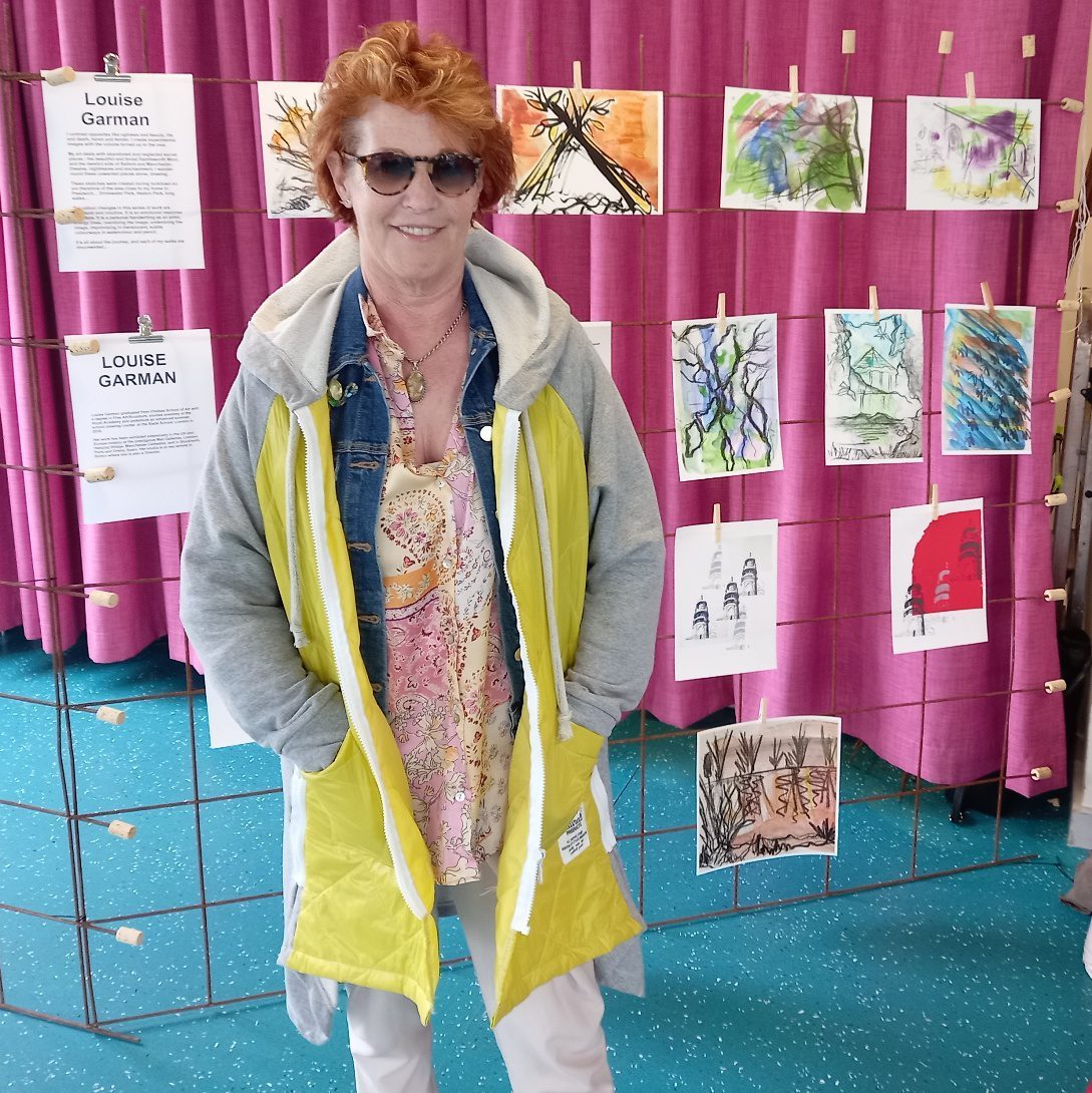 Louise Garman beside a display of sketches at the Bury New Road festival
