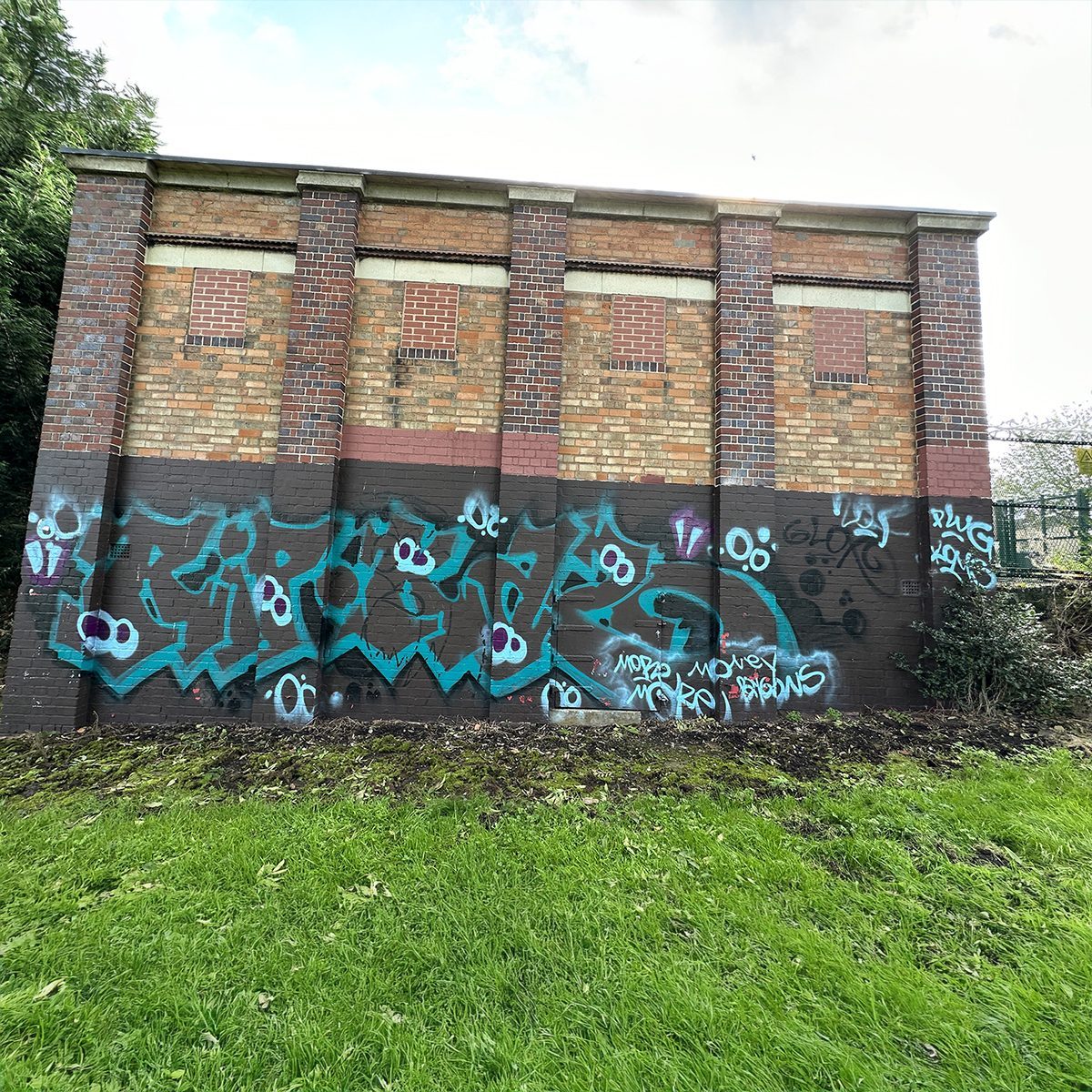 The Trittiford Park building covered in graffiti, before the wildlife mural was painted