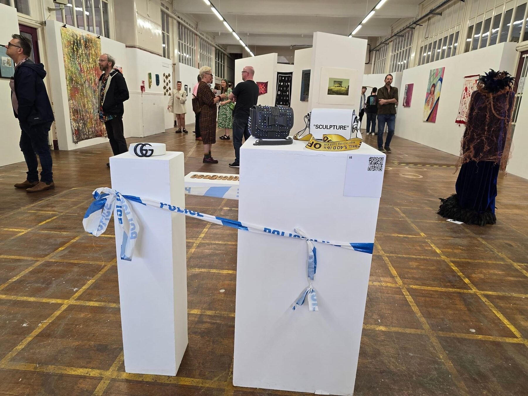 Installation view of the NEO: Artists O-P-E-N Exhibition 2024 at Rogue Artists' Studios, Openshaw, with visitors viewing the work