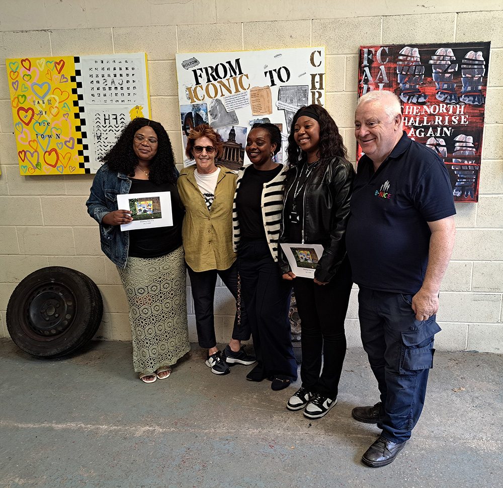 Louise Garman with the B-Nice team in front of the exhibition canvases