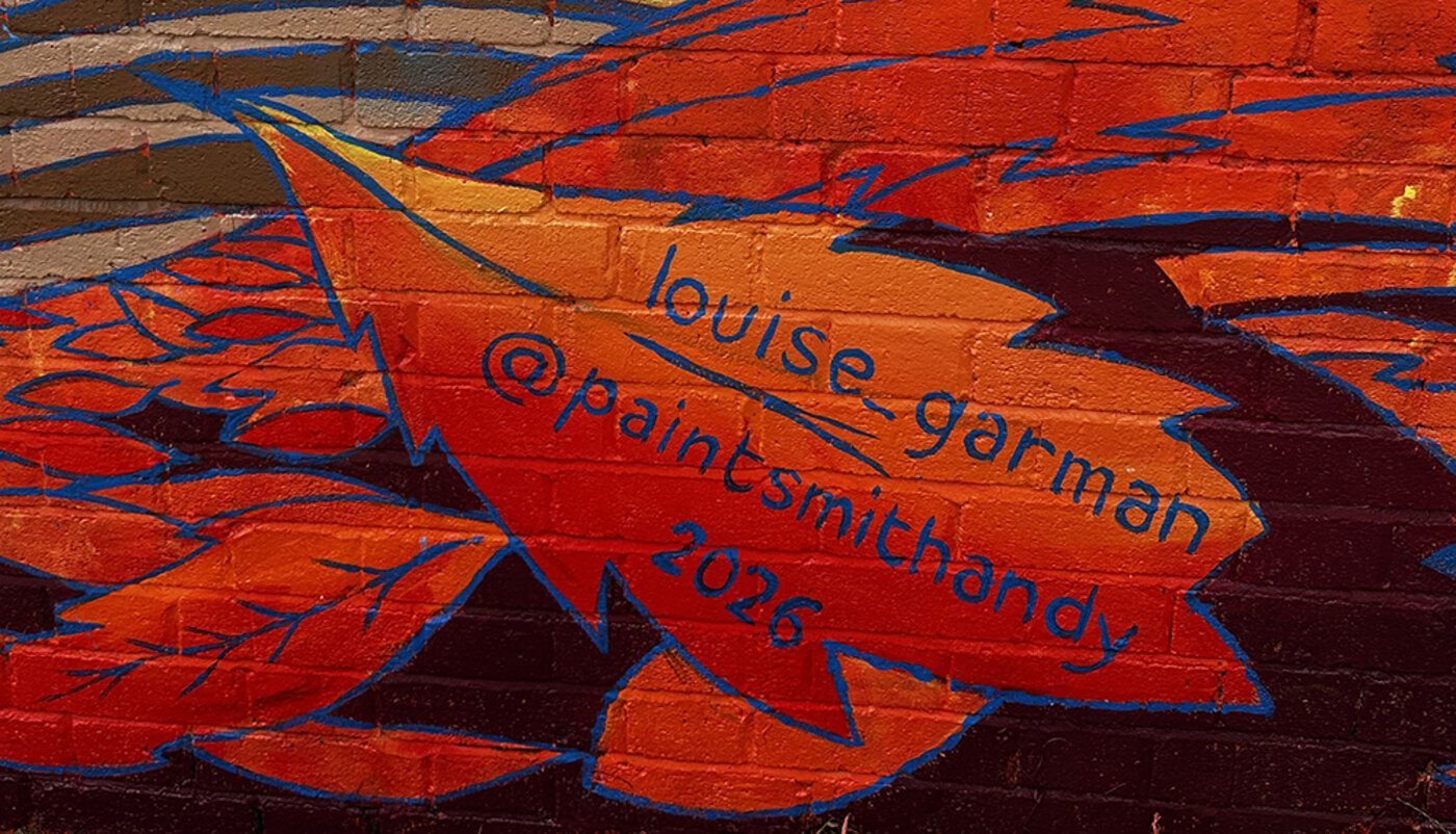 Louise Garman's signature on the autumn section of the mural