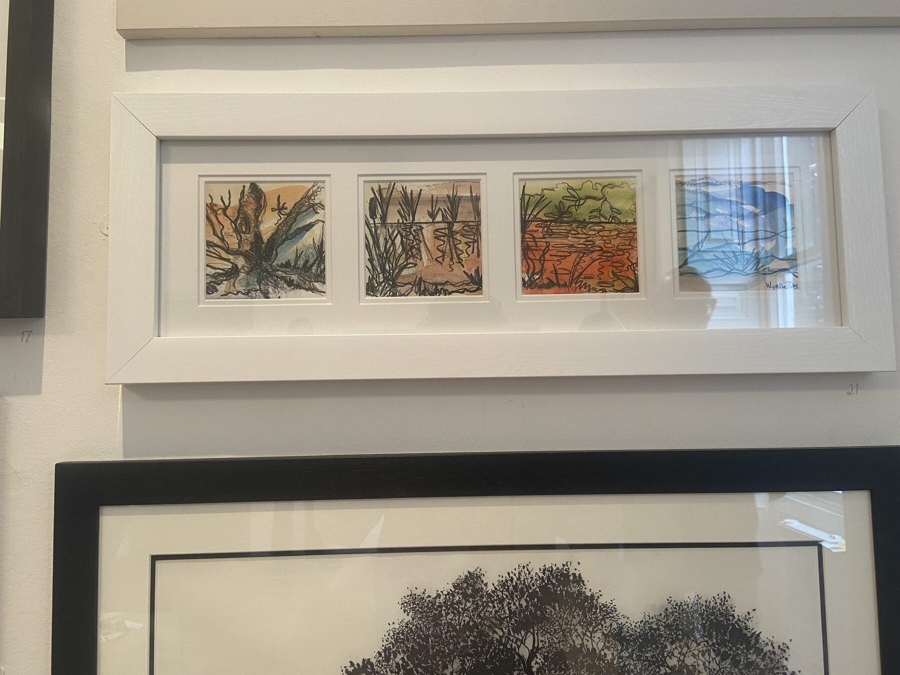 Louise Garman's framed four-panel drawing on display among the exhibition's smaller works