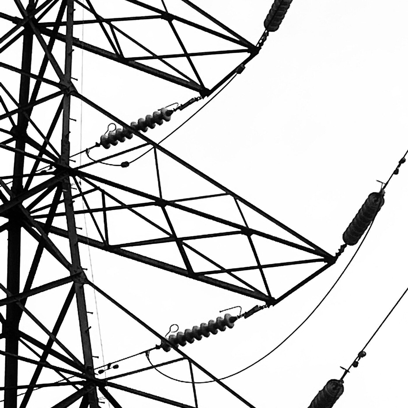 Black and white photograph of an electricity pylon